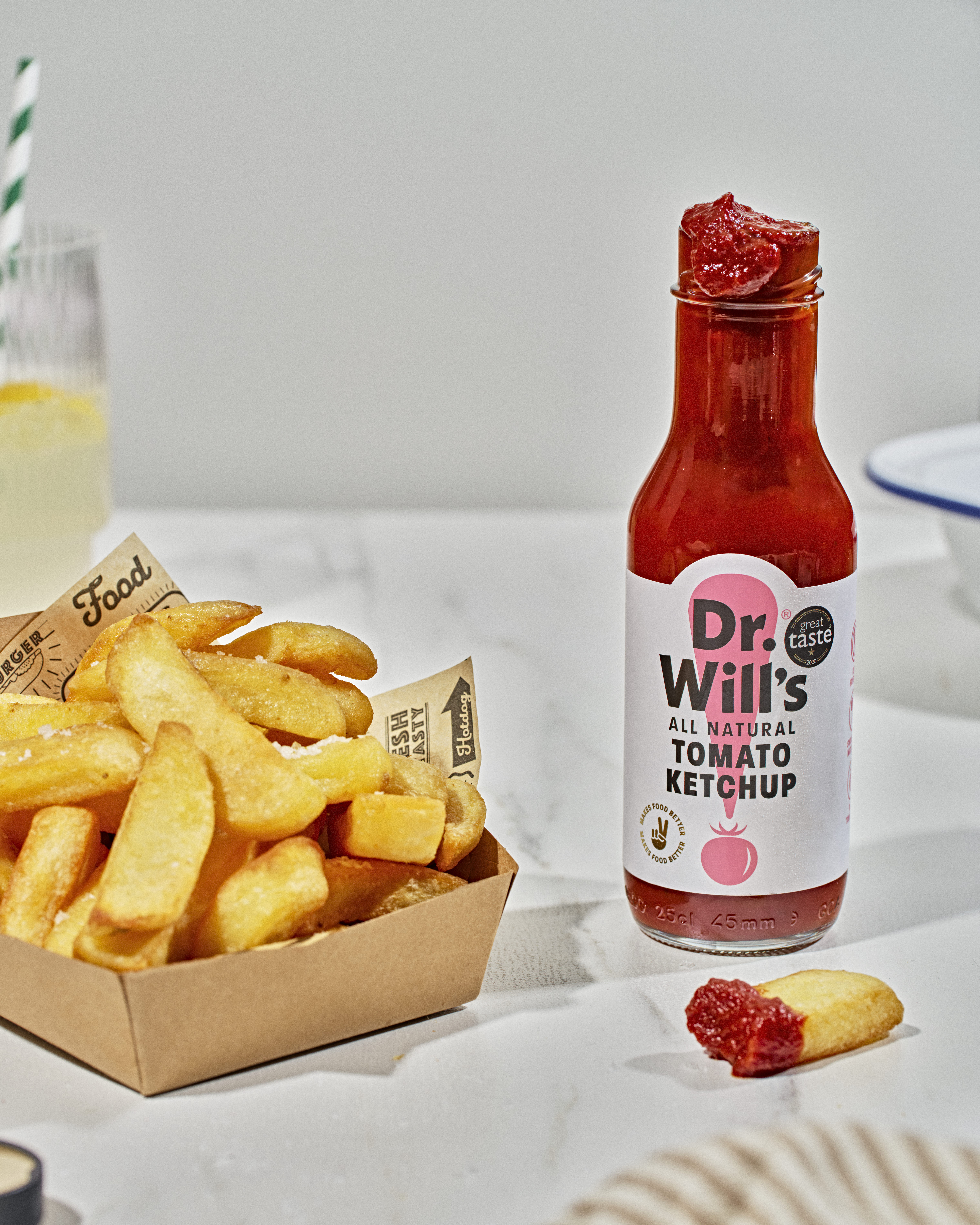 French fries and a bottle of Dr. Will's tomato ketchup.