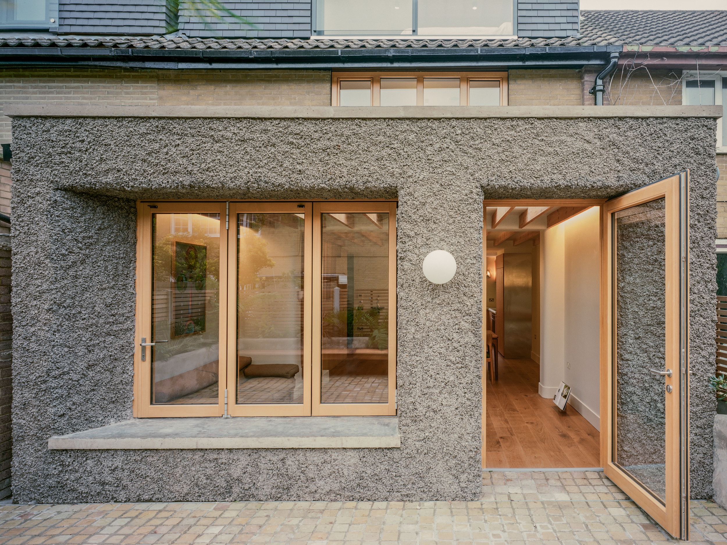 The extension leads to a courtyard garden