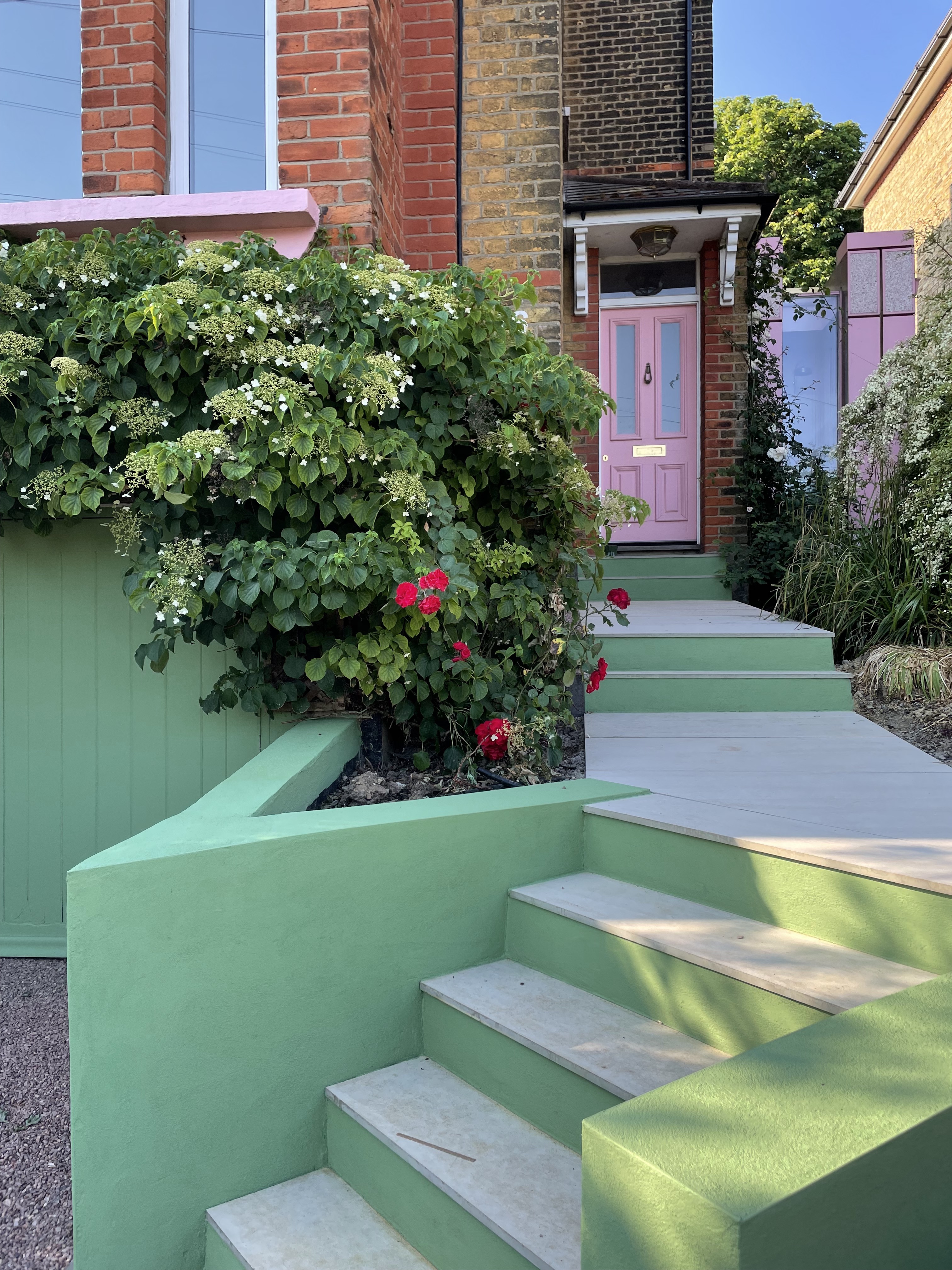 The stairs and garage door are painted in Garden from Little Greene