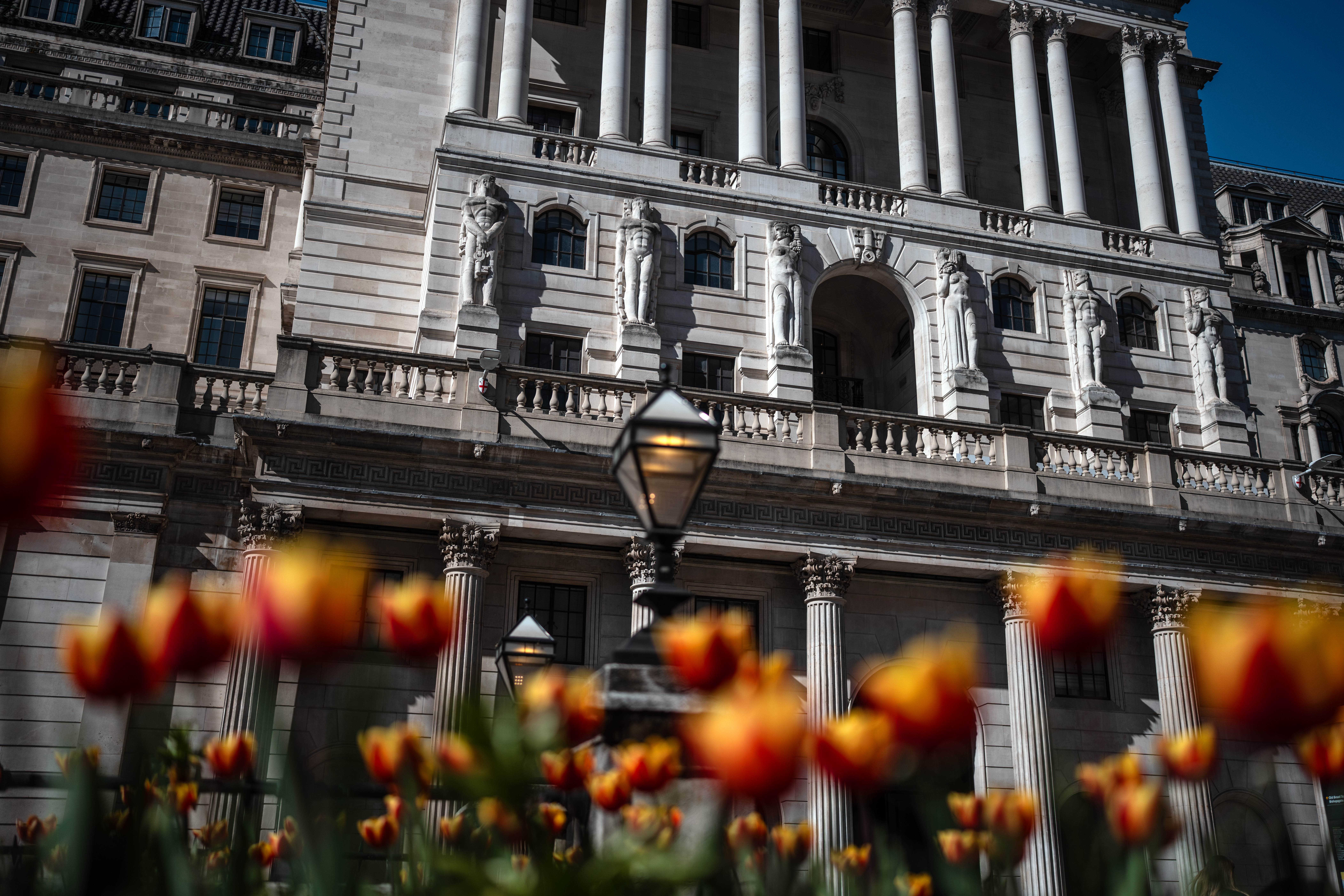 The Bank of England building with tulips in the foreground.