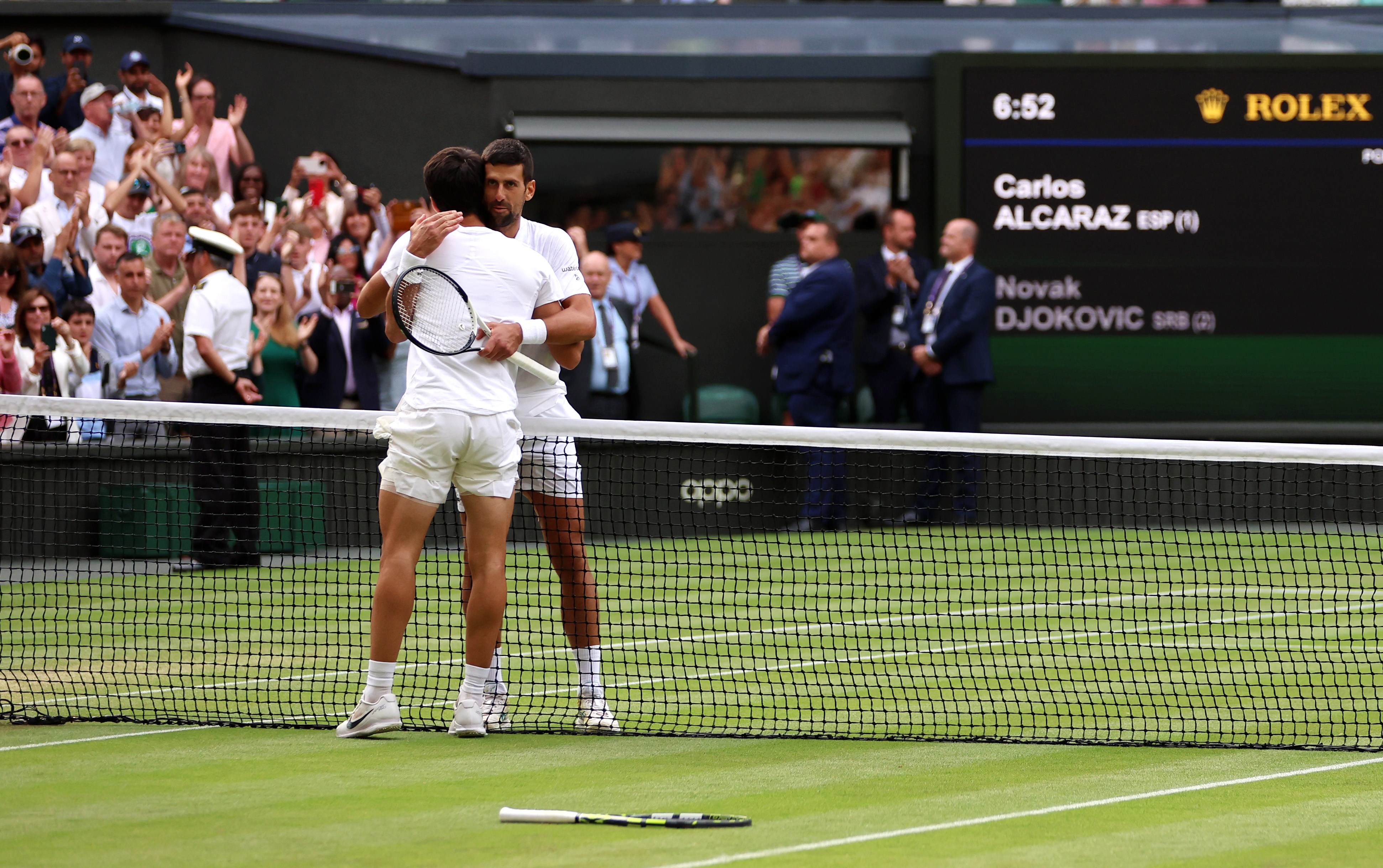 Embracing Novak Djokovic after winning Wimbledon, July 2023