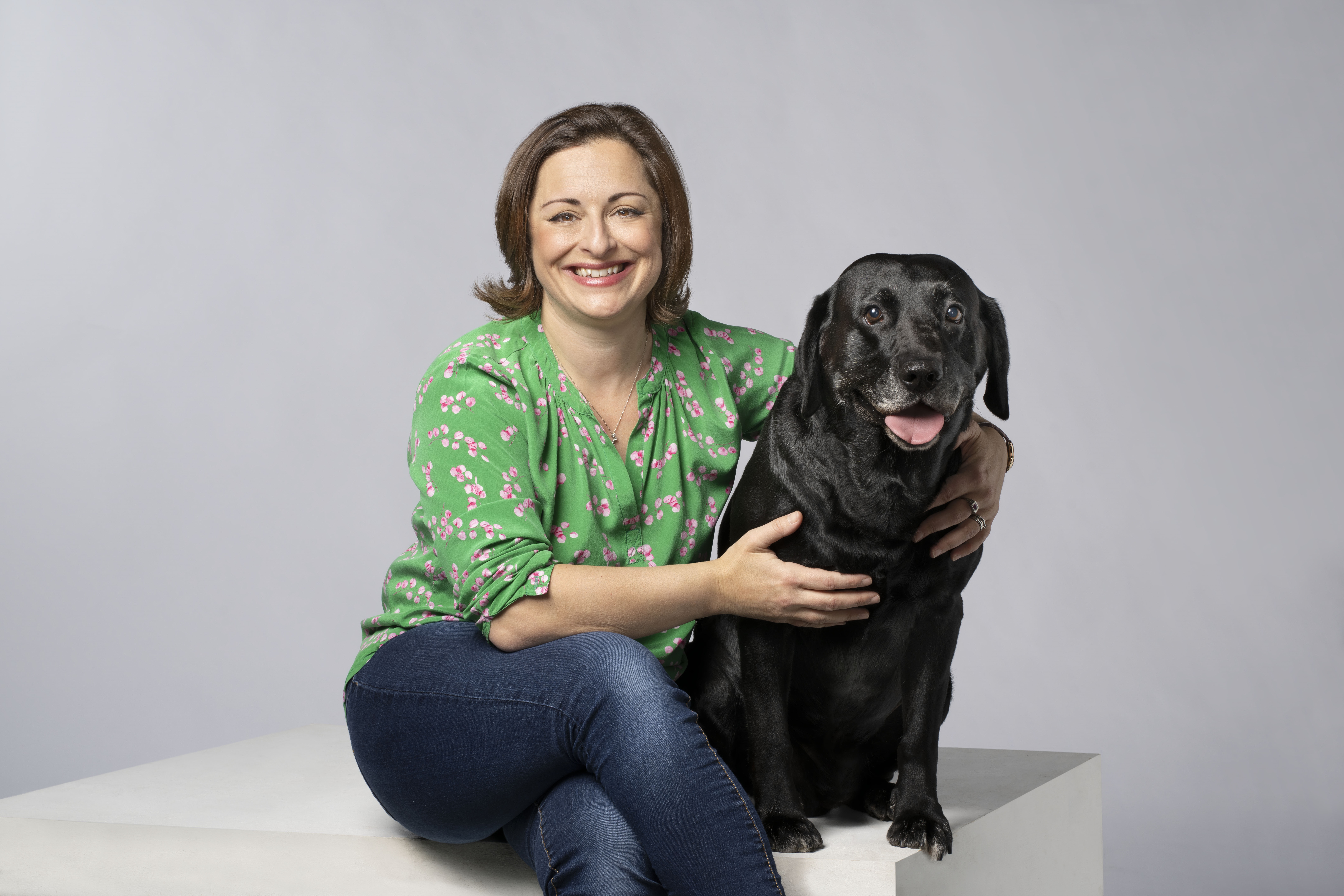 Lyssa McGowan, Pets at Home CEO, with her black Labrador.