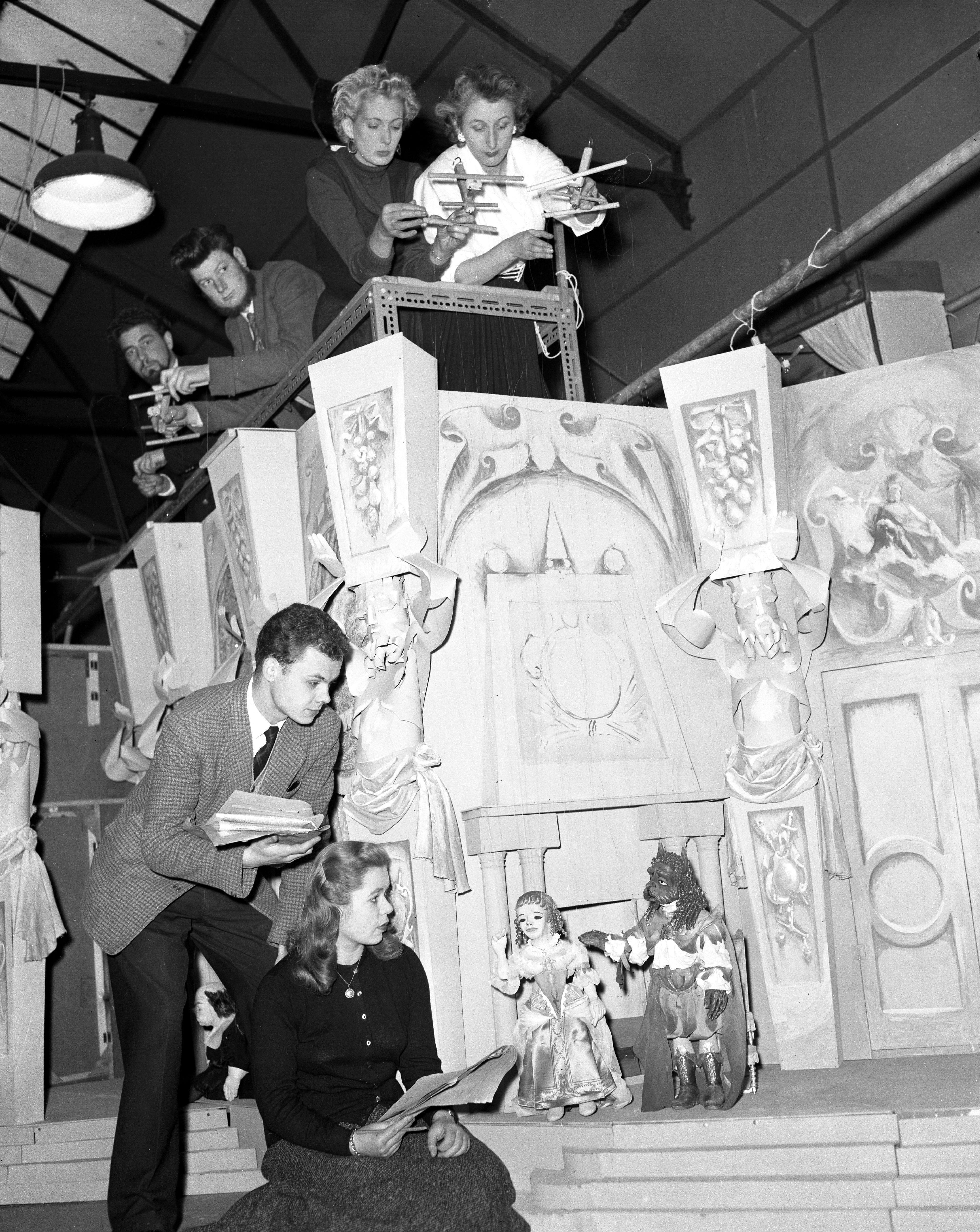 Atterbury’s mother Audrey (top centre, in the white shirt) was a puppeteer for the BBC