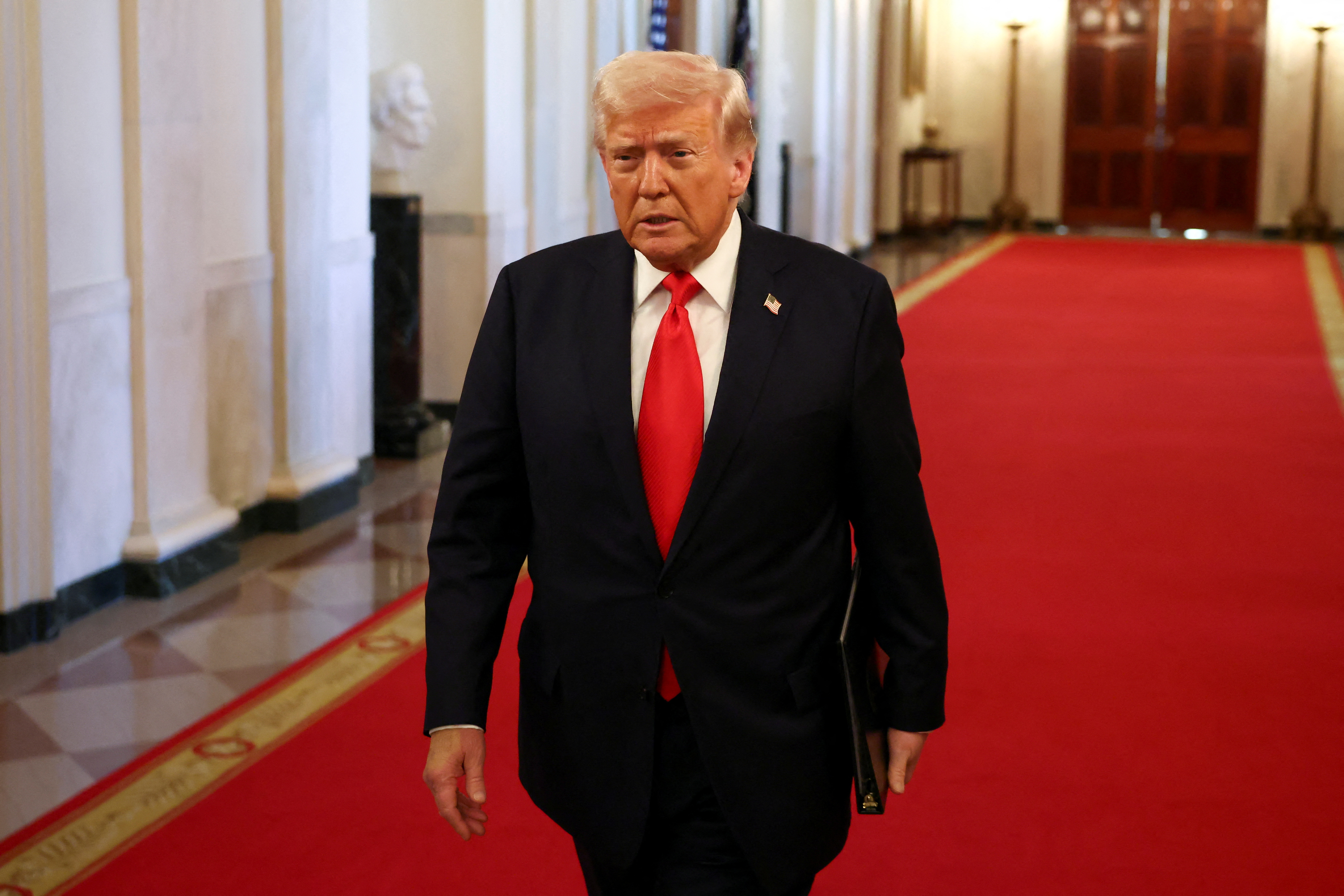 President Trump walking in the White House.