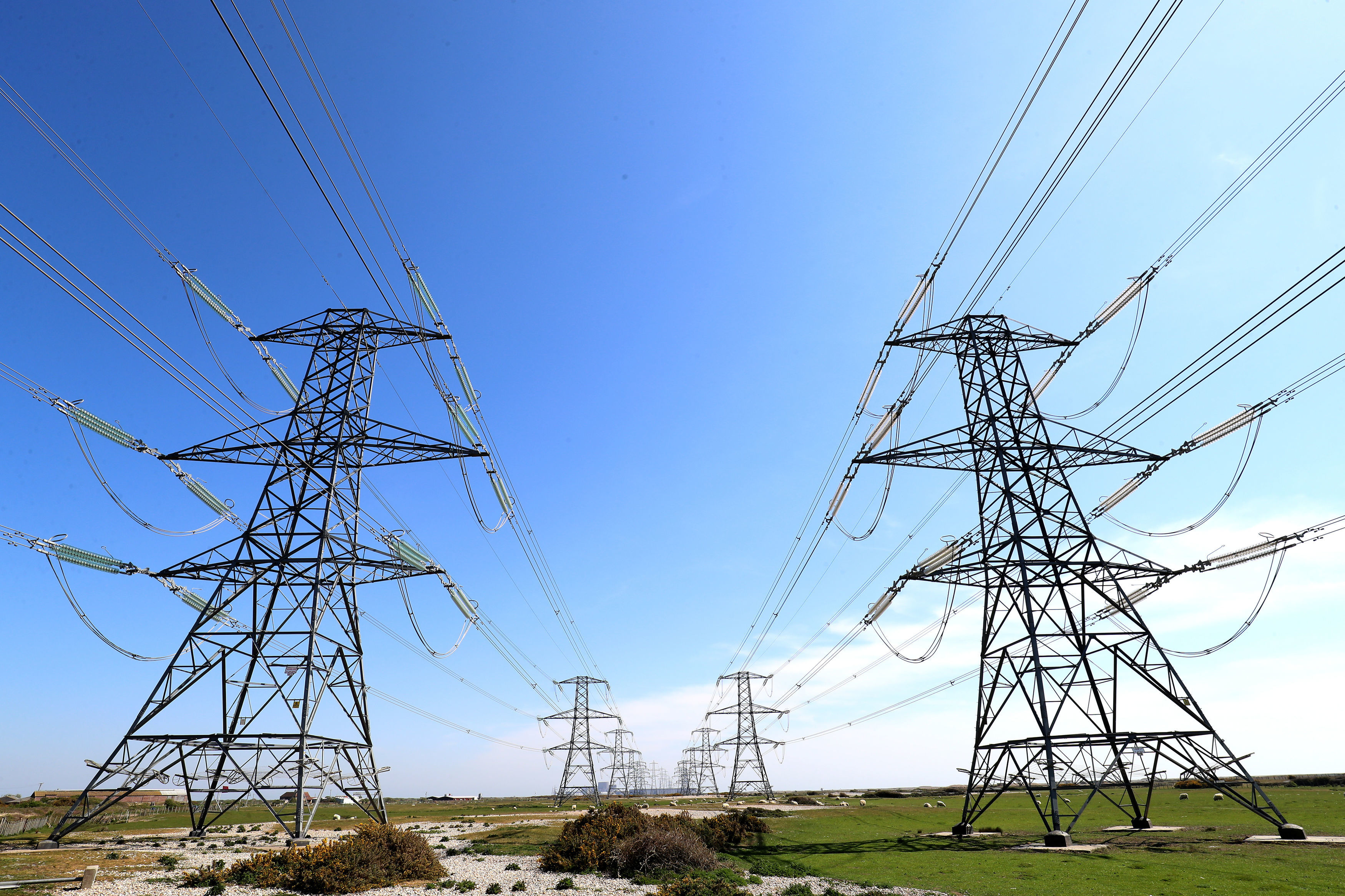 Electricity pylons and transmission lines.