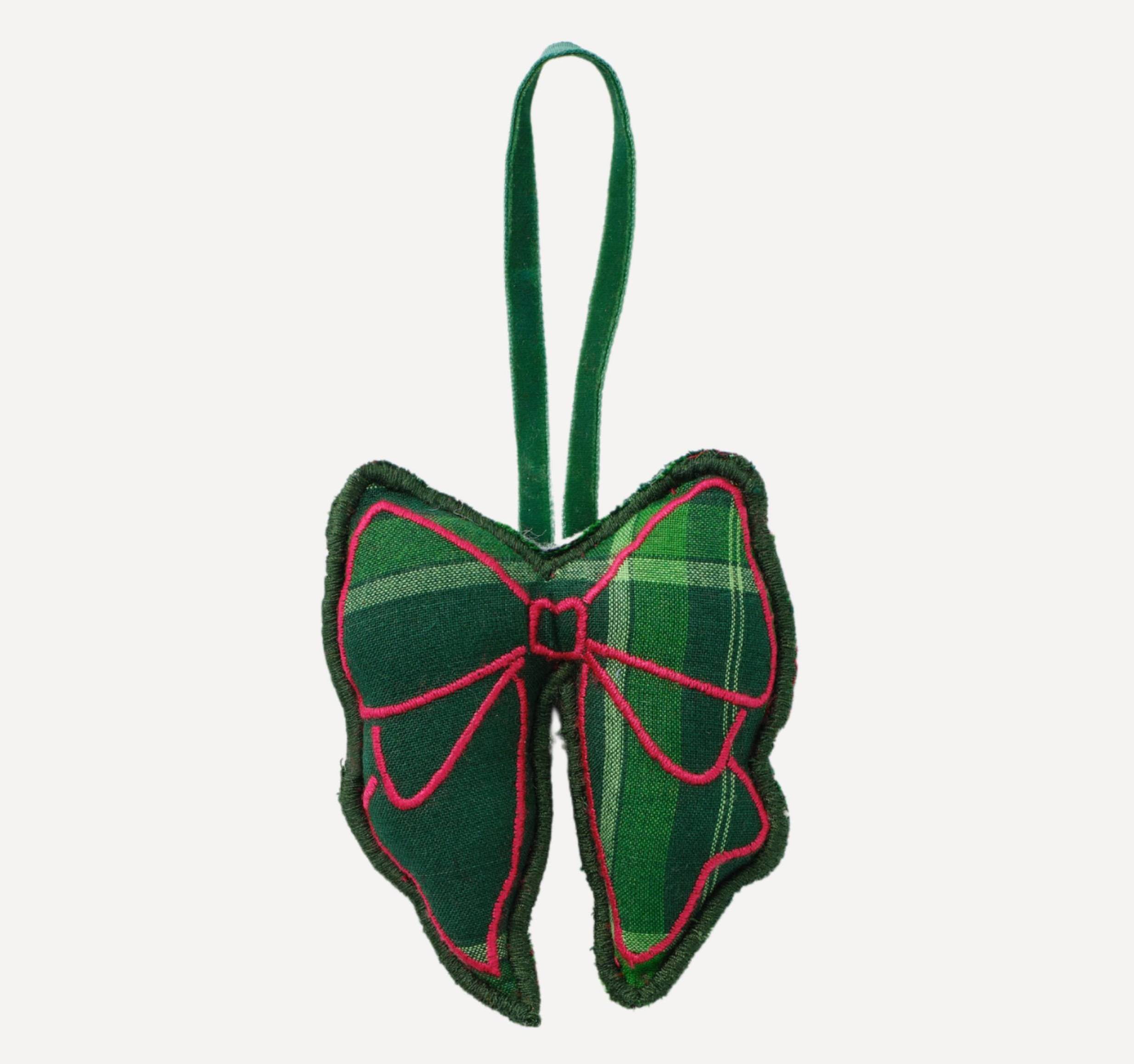 Christmas ornament in green and pink tartan bow.