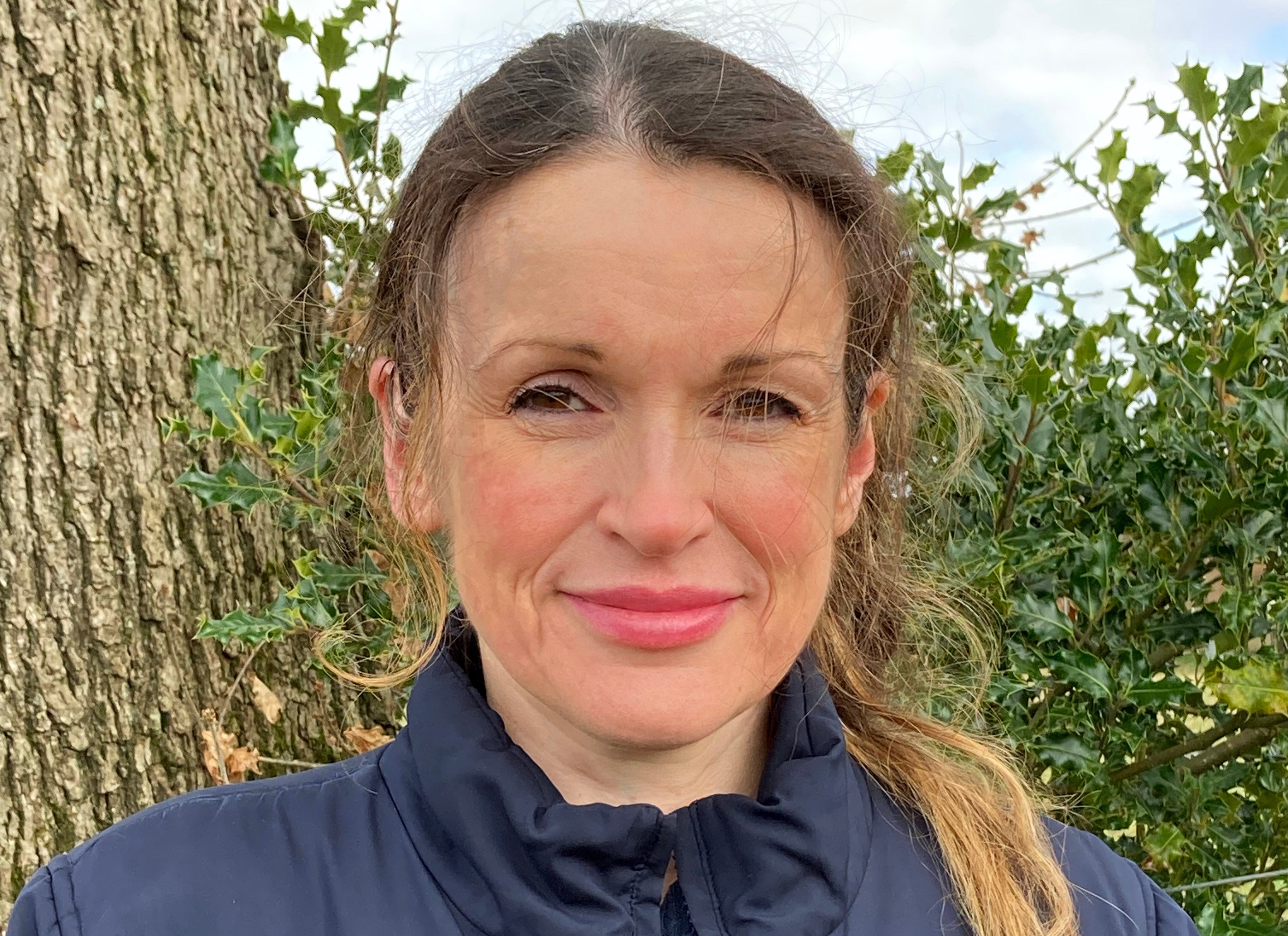 Photo of Jo Livingstone wearing a dark blue Reebok jacket.